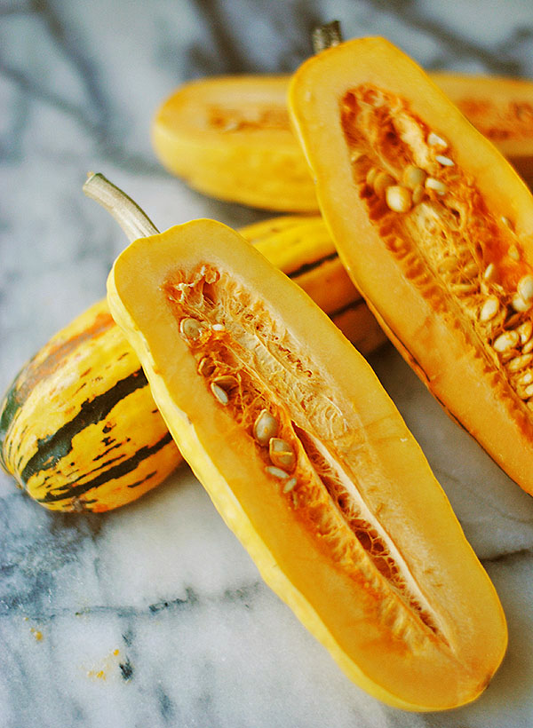delicata squash - this squash variety is by far the easiest to roast and prepare! All you need to do is scoop out the seeds and cut it up! And they hold their shape while cooked. We love to add it to our kale salad recipe or as a side dish. | shemadeitshemight.com