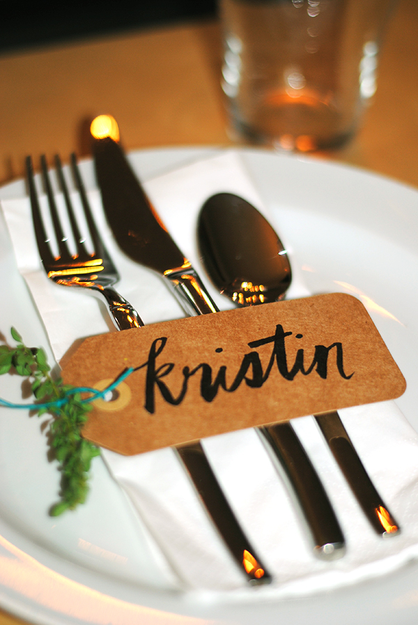 white plate with silverware and place tag that says Kristin