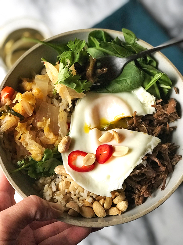 Korean Beef Bowl | bowls of beef, spinach, rice or veggies, kimchi, peanuts, cilantro and an over easy egg. #shemadeit #Koreanbeef #healthyfood #instantpot #foodie #glutenfree #foodblogger #reacipe #protein #spinach #grainbowl #putaneggonit #winterfood #onthetable #foodgawker #dinnertime #mealprep #whatsfordinner #whole30 #loveyourlunch #feedfeed #f52grams #realfood #buzzfeedfood @thefeedfeed #instafood #eater #tacos #beefbowl | shemadeitshemight.com