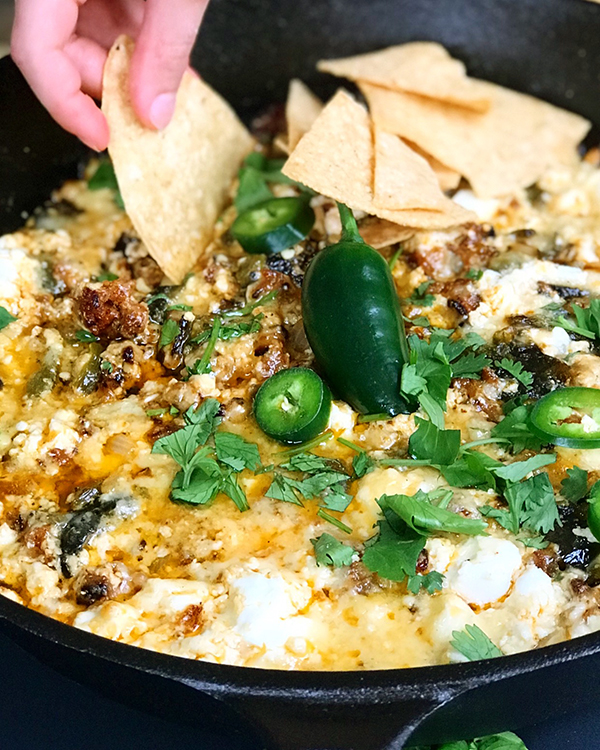 queso fundido with roasted poblano and chorizo verde | Melty warm cheese dip with chips, what more could you want? The perfect party food! #shemadeit #hemadeit #queso #chorizoverde #Mexicanfood #appetizers #cheese #chipsanddip #tortillachips #chipsandsalsa #glutenfree | shemadeitshemight.com