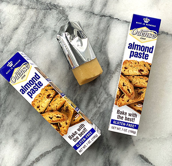 two open boxes of gluten-free almond paste sitting on marble counter