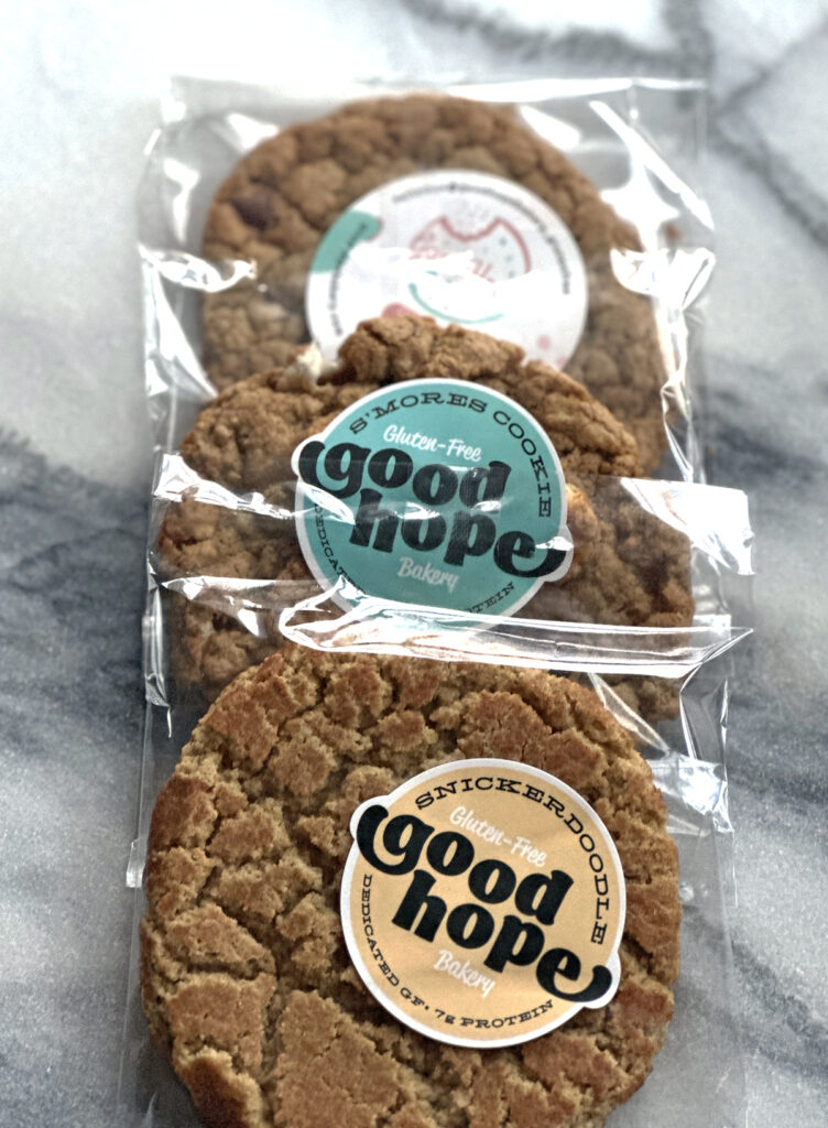 cookies wrapped in plastic with yellow and aqua stickers that say Good Hope Bakery on them.