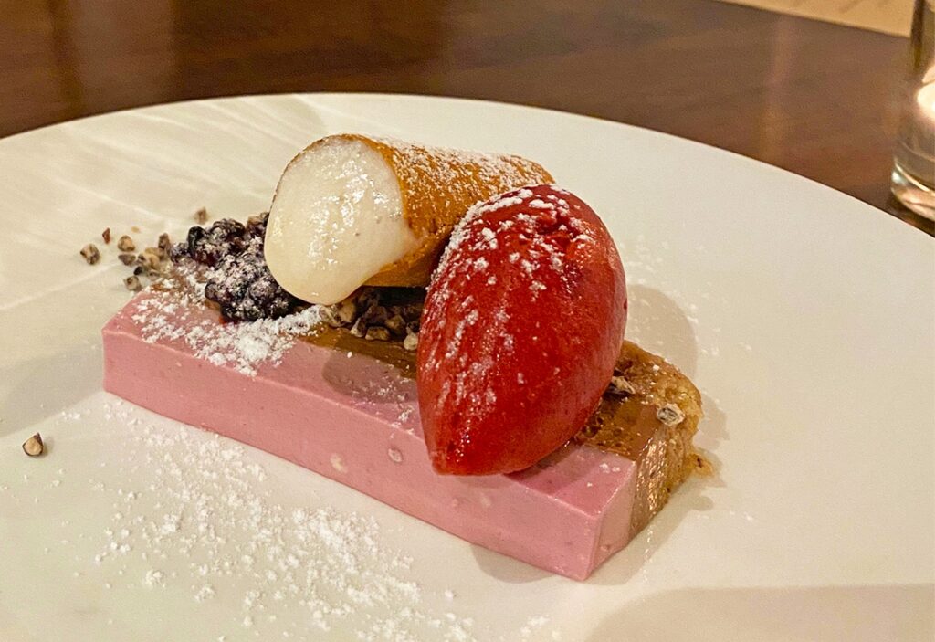 Close-up of a gluten-free dessert with coconut sorbet, raspberry sorbet, and powdered sugar at Spoon and Stable in Minneapolis.